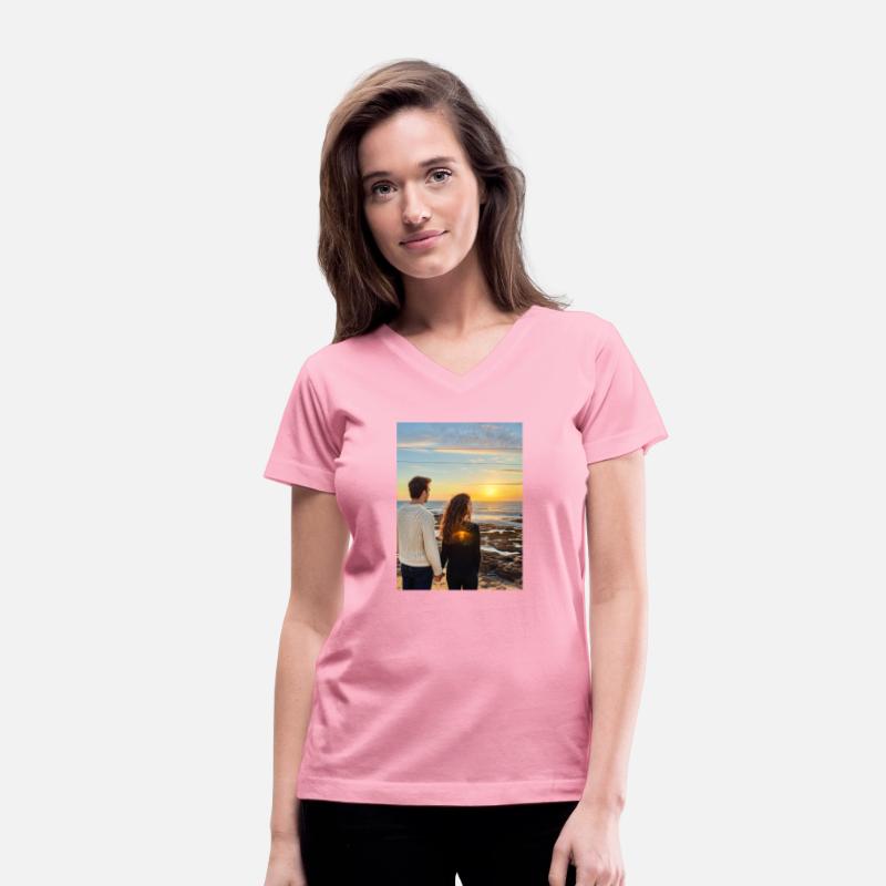 Couple Hand In Hand On Sandy Beach At Sunset